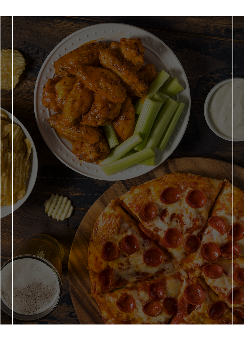 A table with various foods and drinks on it.