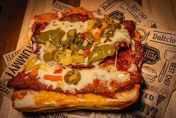Open sandwich with cheese and mixed peppers.