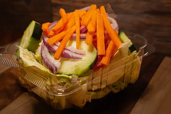Fresh salad with carrots and cucumbers.