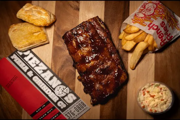 Barbecue ribs with fries and coleslaw.